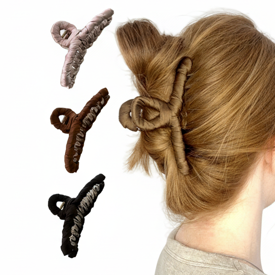 braune Haarklammer in rotem Haar 
links daneben rose, braune und schwarze Haarklammer abgebildet
