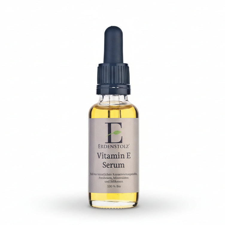 Gelbes Öl in Glasflasche mit Pipette und schwarzem Deckel