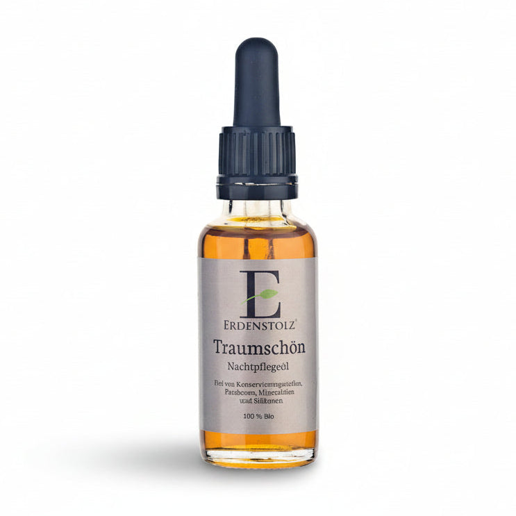 orange braunes Öl in Glasflasche mit schwarzer Pipette